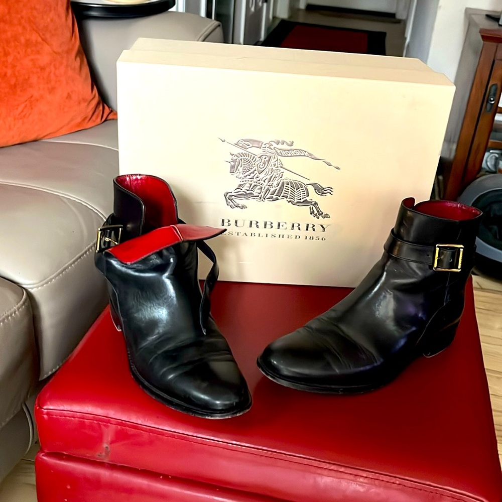 Burberry black with deep red lining all leather. Made in Italy